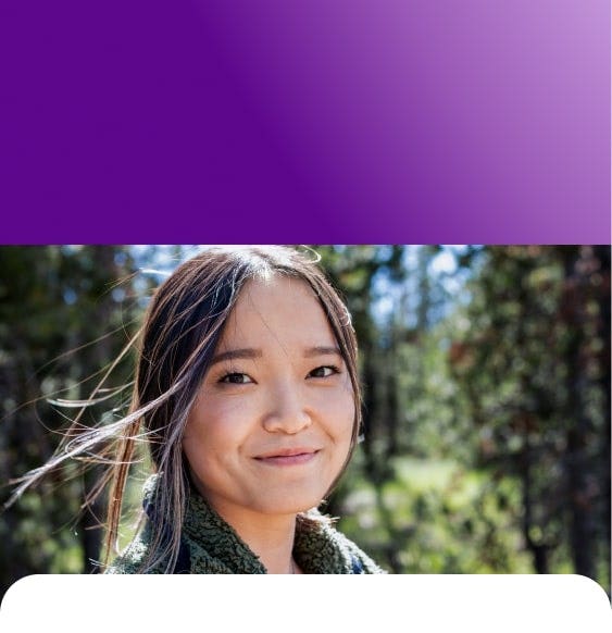 Woman outside, smiling